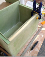 Clamping the inner and outer layer of the fridge box together for gluing