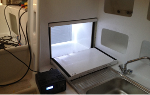 The box in place, door open, LED on.