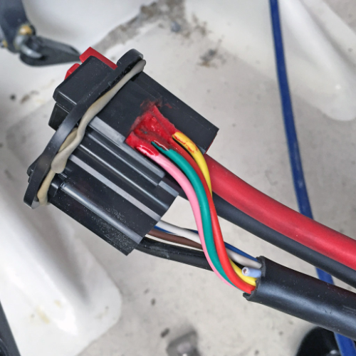 Wiring the plug. Red goop is waterproofing.