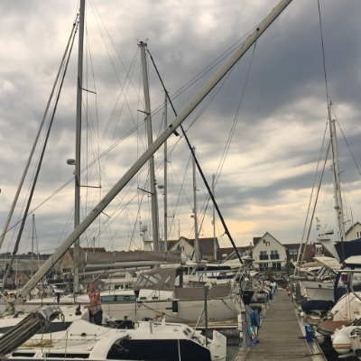 Raising the mast. One of these things is not like the other